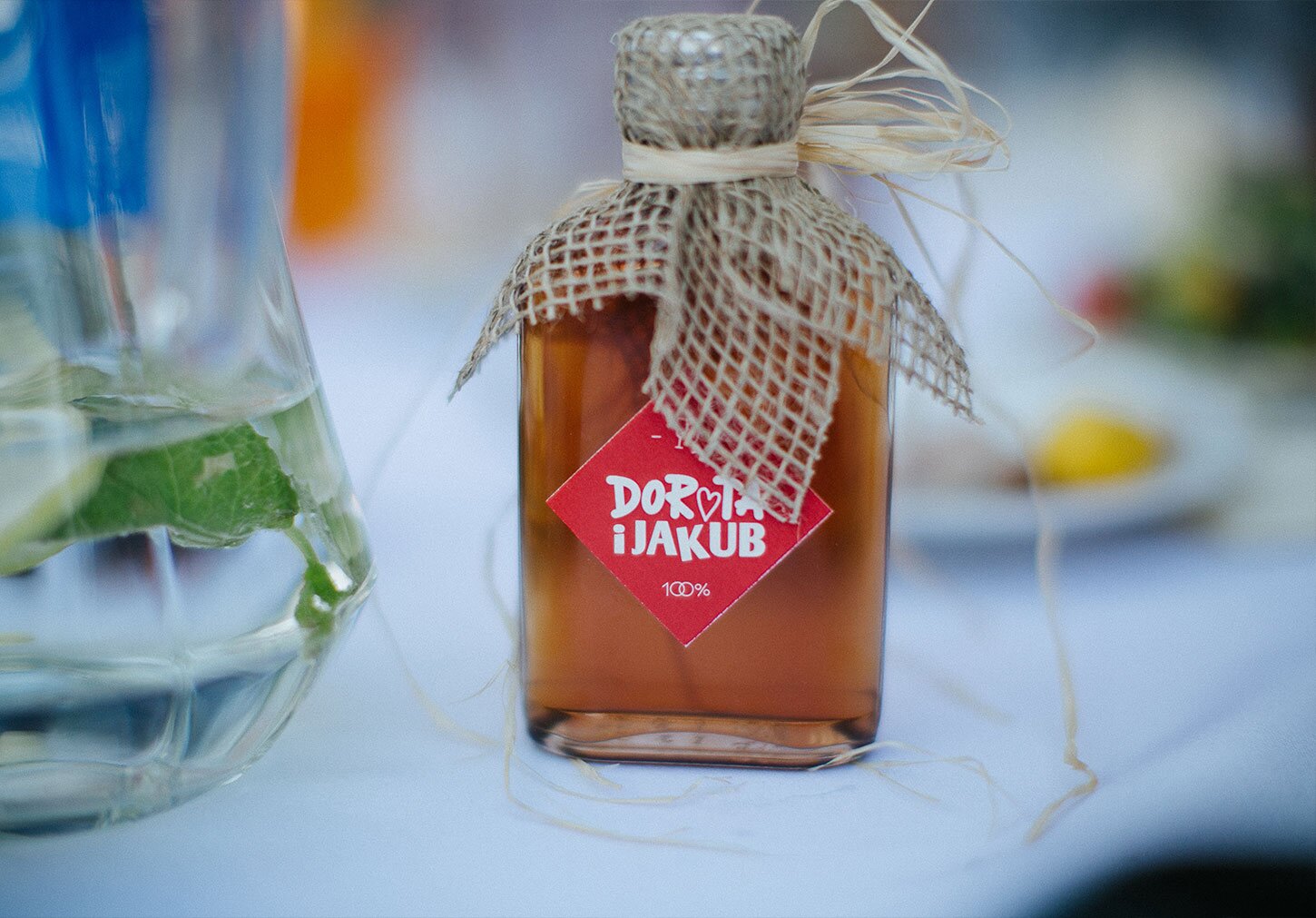 Photography of a small bottle with the main typographic motive on it
