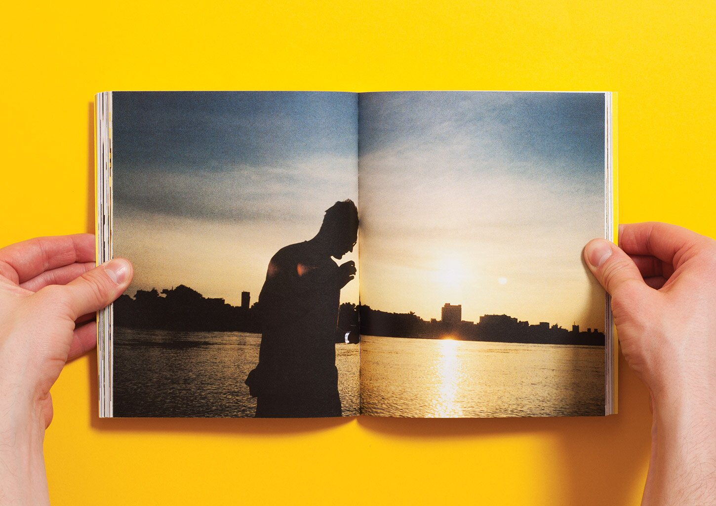 A spread from the UCZTA cookbook with a picture of sunset