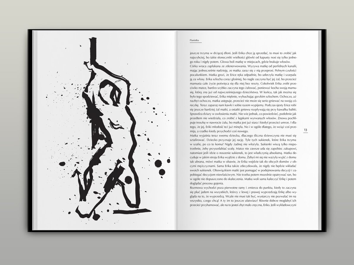 A book spread with a black-and-white illustration of a naked woman.